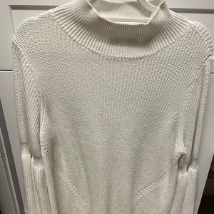 Mick neck and flared sleeves. Amazing and stylish sweater.